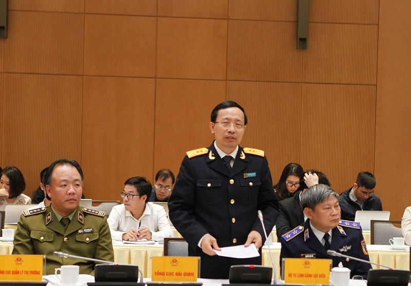 Tổng cục trưởng Tổng cục Hải quan Nguyễn Văn Cẩn tham luận tại Hội nghị về vấn đề Hàng hóa nước ngoài “đội lốt” xuất xứ Việt Nam Ảnh: Q.H